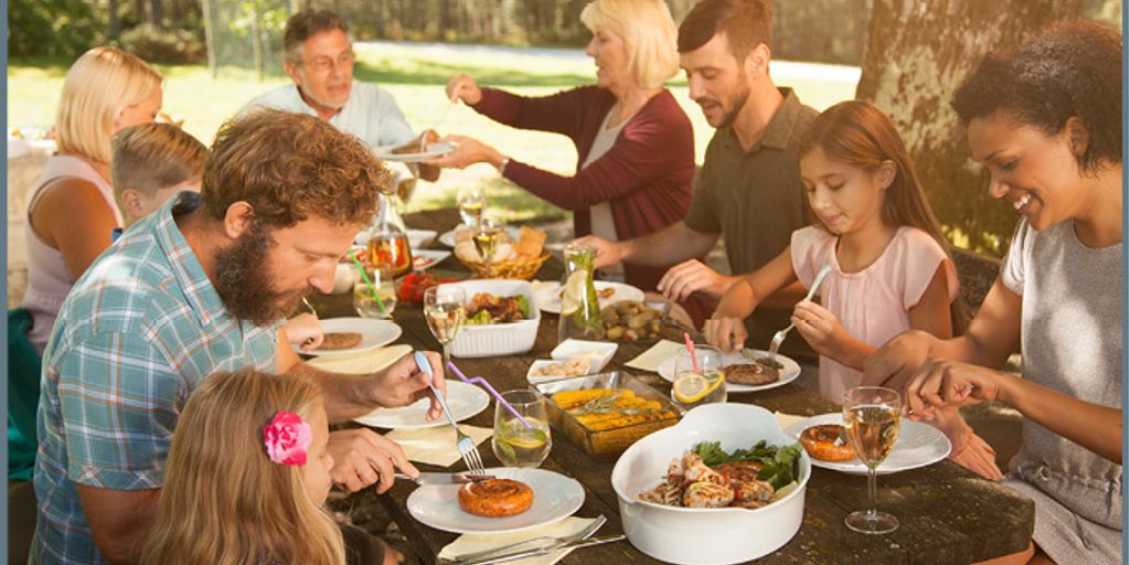 group of diverse people sharing healthy meal in community setting